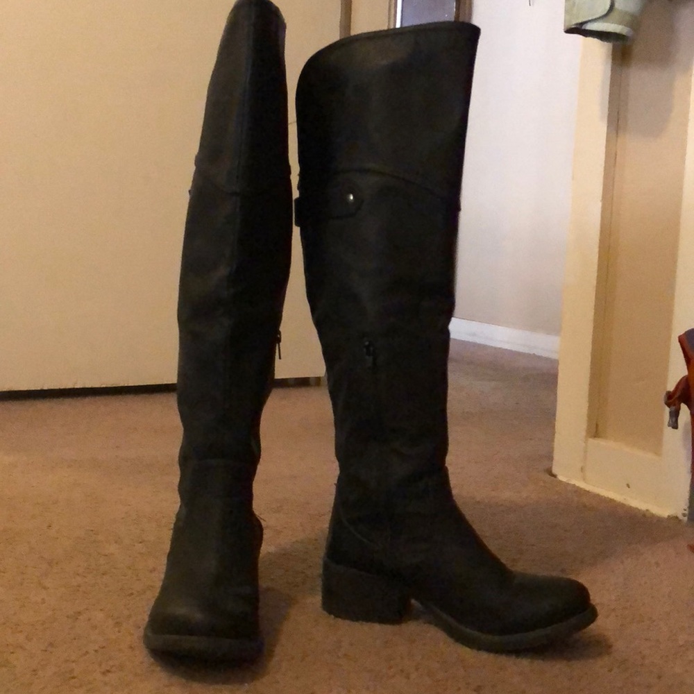 Tall knee high black leather boots